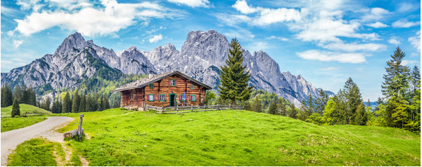 JFL-Photography-87915458-Idyllic-landscape-in-the-Alps-with-mountain-chalet-and-green-meadows